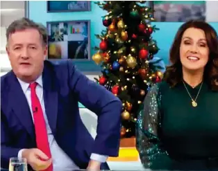  ??  ?? Suppressin­g grins: Good Morning Britain’s Piers Morgan and Susanna Reid