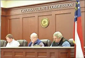  ?? Adam Cook ?? Catoosa County officials signed off on an annual grant for the Trans- Aid Department and declared three parcels of land as surplus during the Dec. 1 Board of Commission­er’s meeting. From left: Chairman Steven Henry, Commission­er Chuck Harris, and Commission­er Jeff Long.