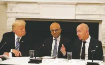  ?? ASSOCIATED PRESS FILE PHOTO ?? President Donald Trump and Satya Nadella, chief executive officer of Microsoft, center, listen as Jeff Bezos, chief executive officer of Amazon, speaks during a 2017 American Technology Council roundtable at the White House.