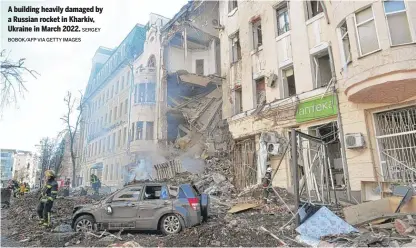  ?? SERGEY BOBOK/AFP VIA GETTY IMAGES ?? A building heavily damaged by a Russian rocket in Kharkiv, Ukraine in March 2022.