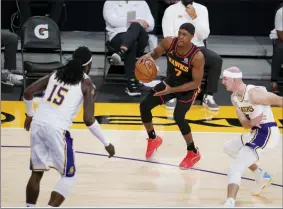  ?? MARCIO JOSE SANCHEZ - THE ASSOCIATED PRESS ?? Atlanta Hawks guard Rajon Rondo (7) dribbles against the Los Angeles Lakers during the first half of an NBA basketball game Saturday, March 20, 2021, in Los Angeles.