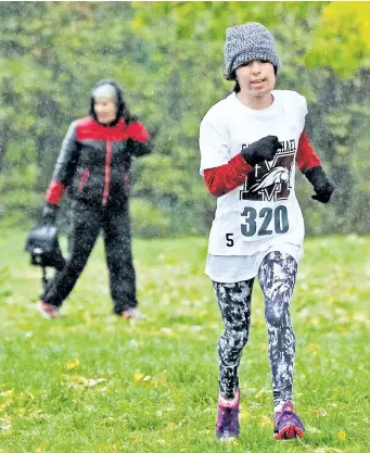  ?? MIKE DIBATTISTA/NIAGARA FALLS REVIEW ?? Julianne Miszk of Niagara Falls running in SOSSA Cross country meet at Firemans Park in Niagara Falls in this October 2016 file photo.