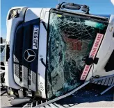  ?? ?? Rubbish day: This 26-ton bin lorry was blown over by strong winds in Leeds