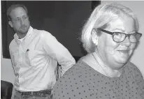  ?? Gregory Clark/The Coastland Times via AP ?? Richie Burke and Martha Wickre, who tied in a race for the town commission in Manteo, N.C., are shown Nov. 27 after a coin toss decided the winner. Wickre called heads, and the coin landed on tails, so Burke was declared the winner.