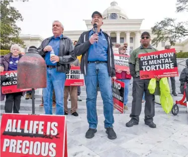  ?? MICKEY WELSH/THE MONTGOMERY ADVERTISER VIA AP ?? Former death row inmates who were exonerated, from left, Randall Padgent, Gary Drinkard and Ron Wright, were among the nearly 100 protesters gathered Tuesday at the state Capitol building in Montgomery, Ala., to ask Gov. Kay Ivey to stop the planned execution of Kenneth Eugene Smith.