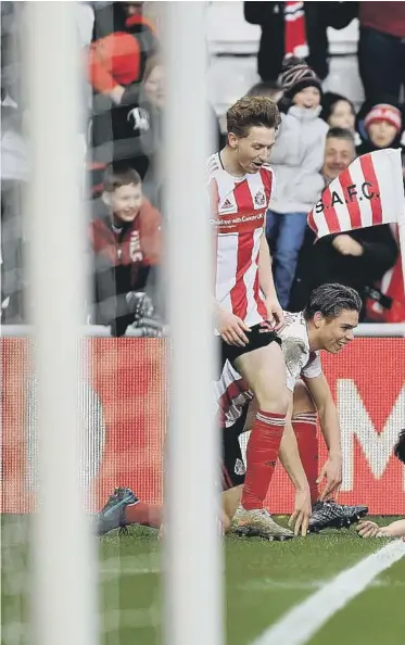  ??  ?? The Sunderland players celebrate a goal.