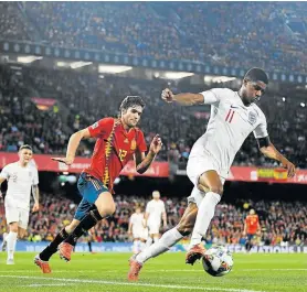  ?? Photo: DAVID RAMOS/GETTY IMAGES ?? CONSISTENT PLAY: Marcus Rashford of England battles for the ball with Marcos Alonso of Spain during the UEFA Nations League A group four match at Estadio Benito Villamarin on October 15 in Seville, Spain.