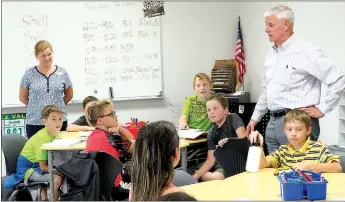  ?? Westside Eagle Observer/RANDY MOLL ?? U.S. Congressma­n Steve Womack visits with Gentry fourth-grade students in their new classroom facility on Aug. 22. Womack toured the facility and spoke with students, teachers and staff members.