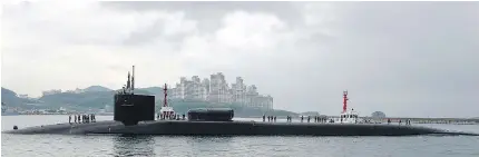  ?? — GETTY IMAGES ?? The USS Michigan arrives Tuesday in Busan, South Korea. According to the U.S. Navy’s Submarine Force Pacific website, the Michigan carries more than 150 Tomahawk cruise missiles.