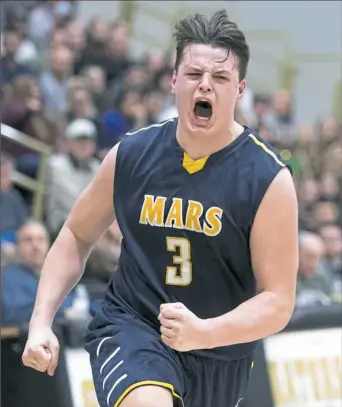  ?? Steph Chambers/Post-Gazette photos ?? Michael Carmody celebrates after Mars’ 60-51 victory against Highlands Friday at Gateway High School. With the win, Mars moves on to the PIAA Class 5A semifinals.