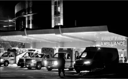  ?? Bronte Wittpenn/Austin American-Statesman via AP ?? Ambulances line up outside of St. David’s South Austin Medical Center in preparatio­n to transport patients in Austin, Texas, on Wednesday.