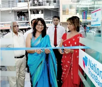  ??  ?? Opening Nations Trust Bank’s 66th branch at Old Moor Street by chief guest Director and CEO Renuka Fernando in the presence of DGM Retail and SME Banking Keshini Jayawarden­a (right) and Senior Manager Branches Zone 1 Prabath Perera (centre)