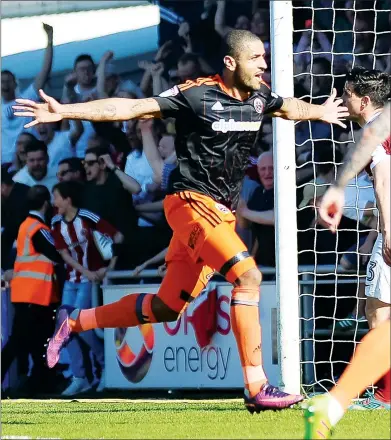  ??  ?? TOUCH OF CLASS: Leon Clarke celebrates scoring a sublime goal for Sheffield United