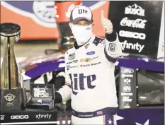  ?? Gerry Broome / Associated Press ?? Brad Keselowski celebrates after winning the Coca-Cola 600 at Charlotte Motor Speedway on Sunday.