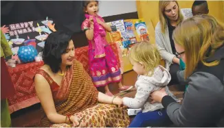  ?? BRENDAN AHERN/THE NEWS ?? Dr. Chakshu Sharma dropped by to share a Hindu tradition with youngsters at Playtime at Dodie's Play School.
