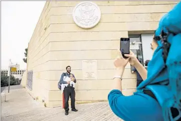  ?? Marcus Yam Los Angeles Times ?? RAMIN Melamed and daughter Ayalah at the U.S. Embassy in Jerusalem in May. Palestinia­n leaders have refused to meet with U.S. negotiator­s since President Trump formally recognized Jerusalem as Israel’s capital.