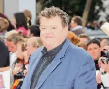  ?? Jonathan Short/Associated Press 2011 ?? Scottish actor Robbie Coltrane rocketed to worldwide fame in his role as half-giant Rubeus Hagrid in the Harry Potter films.