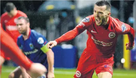  ??  ?? Marty Donnelly celebrates his goal for Larne in their Premiershi­p win over Linfield