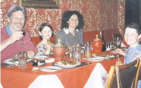  ??  ?? > Shaun Russell, with wife Lin and daughters Megan, second left, and Josie at a restaurant in 1996