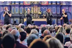  ?? FOTO: NORBERT PRÜMEN ?? In der Paterskirc­he ließ „Rock 4“Beatles-Lieder erklingen, und zwar a capella.