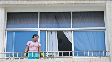  ?? [HUSSEIN MALLA/ THE ASSOCIATED PRESS] ?? An Ethiopian domestic worker cleans her employer's balcony, Saturday, in Beirut.