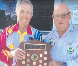  ??  ?? Brandon Bowls Club president Peter Handerson (right) presented the interclub shield to winning club president Dennis Donaldson of the Gold City Bowls Club after the day’s play in Brandon last Saturday.