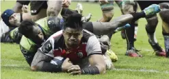  ?? — AFP ?? TOULOUSE: Toulouse’s Samoan lock Iosefa Tekori scores a try during the European Champions Cup rugby union match Toulouse against Connacht on Sunday at the Ernest Wallon Stadium in Toulouse, southern France.