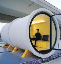  ?? VINCENT YU, THE ASSOCIATED PRESS ?? Architect James Law sits in an OPod tube house in Hong Kong’s Kwun Tong industrial area.