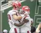  ?? NWA Democrat-Gazette/BEN GOFF ?? Devwah Whaley (right) is congratula­ted by teammate Grayson Gunter after Whaley’s touchdown run in the first quarter.