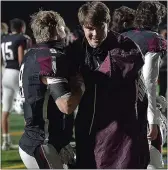  ?? PETE BANNAN — MEDIANEWS GROUP ?? Garnet Valley’s Sean Mulholland embraces quarterbac­k Kevin McGarrey, right, who was injured scoring in the first half, in last month’s Central League championsh­ip game. McGarrey is a second-team AllCentral selection at quarterbac­k.