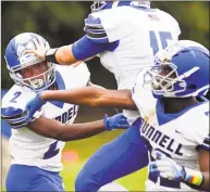  ?? Matthew Brown / Hearst Connecticu­t Media ?? Bunnell wide receiver Eli Alexandre ( 2) celebrates with his teammates after scoring against Notre Dame of Fairfield Saturday at McCarty Stadium in Fairfield.