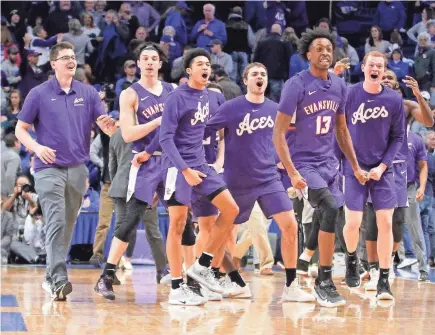  ?? MARK ZEROF/USA TODAY SPORTS ?? Evansville Purple Aces players celebrate after defeating the Kentucky Wildcats at Rupp Arena.
