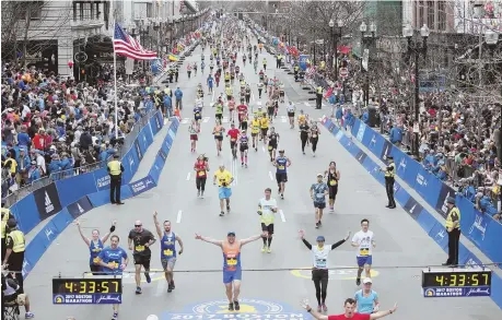  ?? STAFF PHOTOS BY, ABOVE, NICOLAUS CZARNECKI; TOP, MATT WEST ?? JUST IN CASE: Boston FBI Chief Harold Shaw says that despite the lack of threats against the upcoming Boston Marathon, the bureau and local police department­s will prepare for all types of potential attacks. Above, scenes from last year’s marathon.