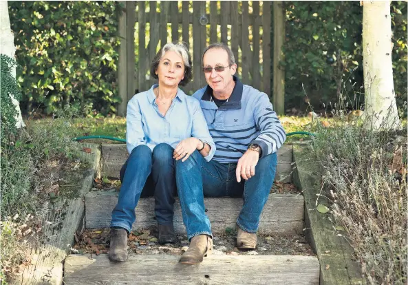  ??  ?? Grieving: Fiona and Gavin Mason at their East Sussex home