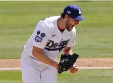  ?? Ap ?? JACKED AND PUMPED: Clayton Kershaw celebrates after a strikeout yesterday against Washington.