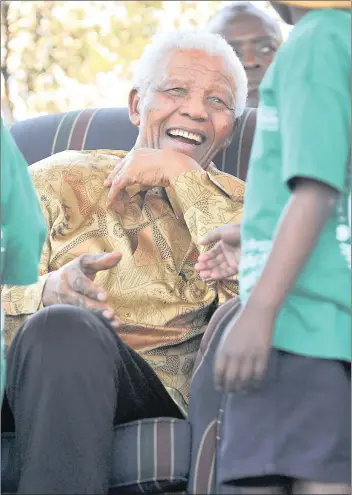  ?? PICTURE: MUJAHID SAFODIEN ?? GREAT ROOTS: Nelson Mandela and his wife Graça Machel planted the 90 990th tree in Soweto in celebratio­n of Arbor Week in September 2008. The tree has now been declared a heritage site.