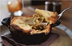  ?? KENNETH K. LAM/BALTIMORE SUN PHOTOS ?? The turkey pot pie at Food Plenty in Clarksvill­e, with crispy peas and other vegetables, hit the comfort-food zone nicely. Rating: Where: 12250 Clarksvill­e Pike, Clarksvill­e Contact: 410-531-0411, foodplenty.com Open: 5 p.m. to 10 p.m. for dinner...