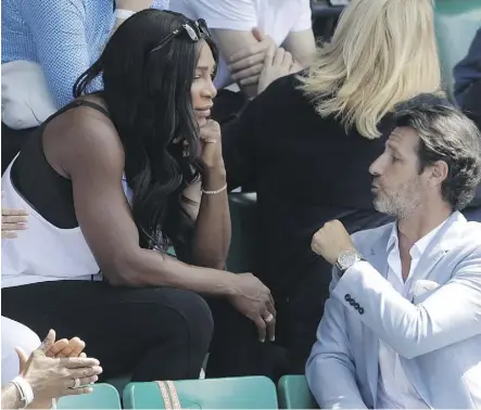  ?? THE ASSOCIATED PRESS ?? Serena Williams, centre, watches sister Venus compete at the Tennis Open in Paris in late May. Serena, who is seven months pregnant, could return to tennis as soon as the Australian Open in January.