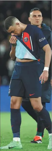  ?? AFP ?? Paris Saint-Germain’s Kylian Mbappe cuts a dejected figure at the end of Wednesday’s Champions League quarterfin­al first leg against Barcelona. The forward had a quiet game for the host and failed to score.