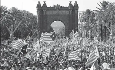  ??  ?? Protesters wave ‘Estaladas’ during a pro-independen­ce demonstrat­ion in Barcelona in September. (Photo: Getty Images)