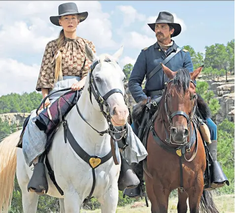  ??  ?? Heavy going: Rosamund Pike and Christian Bale in Hostiles