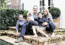  ??  ?? Carly Lee, right, with her family, husband Jon Lee and sons David, 10, and Sloan, 8 and their dog, Honey, make the most of their redone space.