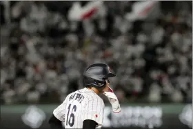  ?? EUGENE HOSHIKO — THE ASSOCIATED PRESS ?? Shohei Ohtani of Japan advances to third base in the 4th inning during their Pool B game at the World Baseball Classic (WBC) at the Tokyo Dome Thursday, March 9, 2023, in Tokyo.