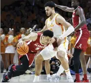  ?? WADE PAYNE — THE ASSOCIATED PRESS ?? Alabama’s Jahvon Quinerly, left, collides with Tennesse’s Olivier Nkamhoua in Wednesday’s game. Alabama is seeded No. 1overall in a preview of the NCAA tourney top 16seeds released Saturday by the selection committee.