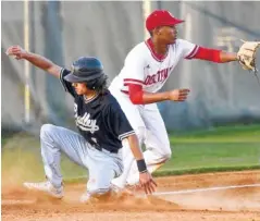  ??  ?? Bradley Central’s Ryan Giovengo slides safely into third base Tuesday as Ooltwah’s Kael Williams waits for the throw.