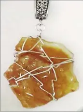  ??  ?? Semi precious pendant