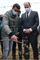  ?? — AFP photo ?? Castex speaks with a winegrower (left) in Montagnac, near Beziers, southern France in a vineyard affected by the frost early this month.