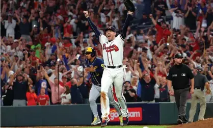  ?? Photograph: Kevin C Cox/Getty Images ?? Freddie Freeman celebrates the Braves’ win over the Brewers.