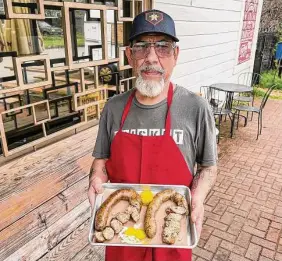  ?? ?? Sausage maker Aaron Lazo Sr. makes a course-textured boudin at Henderson & Kane that’s smoked for several hours.