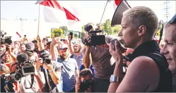  ?? Getty Images/tns ?? Opposition leader Maria Kalesnikav­a addresses workers on strike on Aug. 17 in Minsk. President Alexander Lukashenko has ordered a crackdown on protesters.